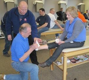 LPST's Ed Earnest provides taping tips to Wayne and Pam Hayes of Three Rivers Christian